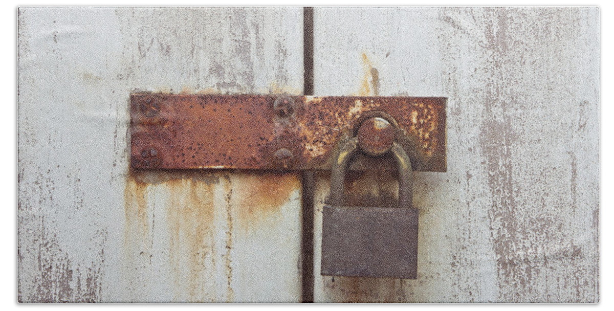 Aged Hand Towel featuring the photograph Rusty lock by Tom Gowanlock