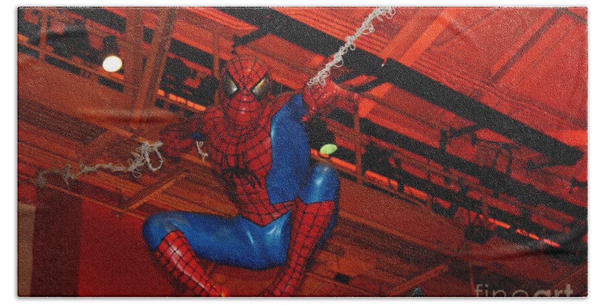 Spiderman Swinging Through The Air Hand Towel featuring the photograph Spiderman Swinging Through the Air by John Telfer