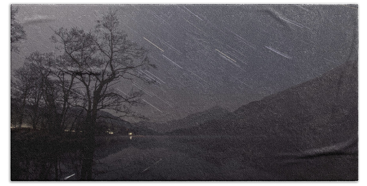 Star Trails Hand Towel featuring the photograph Star trails over lake by B Cash