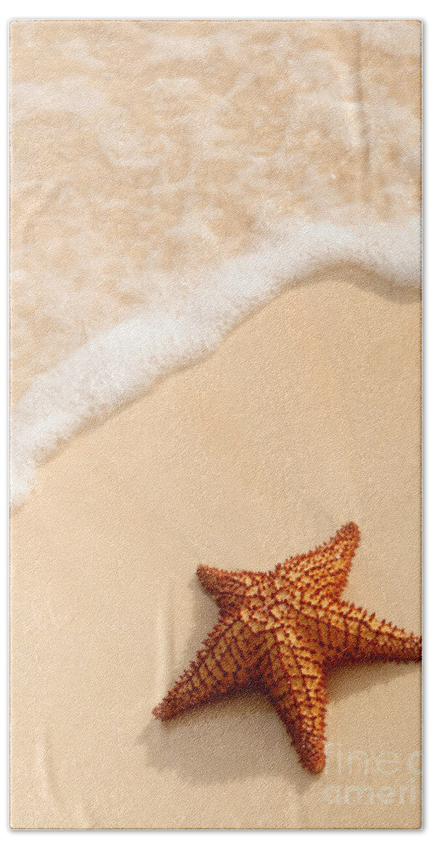 Starfish Bath Towel featuring the photograph Starfish and ocean wave by Elena Elisseeva