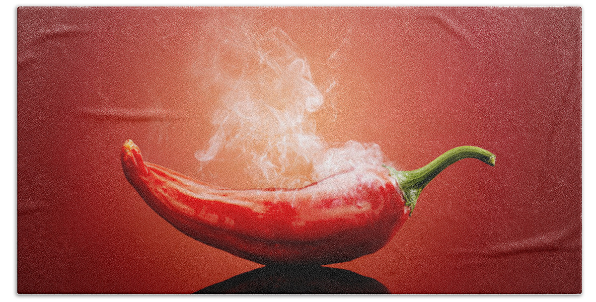 Chillichiliredsmokesmokinghotburnburningsteamsteamingcapsicumcayennejalapenopaprikapeppergradientbackgroundreflectionreflectivetablestudioshotvegetablefreshconceptconceptualstilllifefoodripeimageonenobodyphotographindoors001019xs Bath Sheet featuring the photograph Steaming hot Chilli by Johan Swanepoel