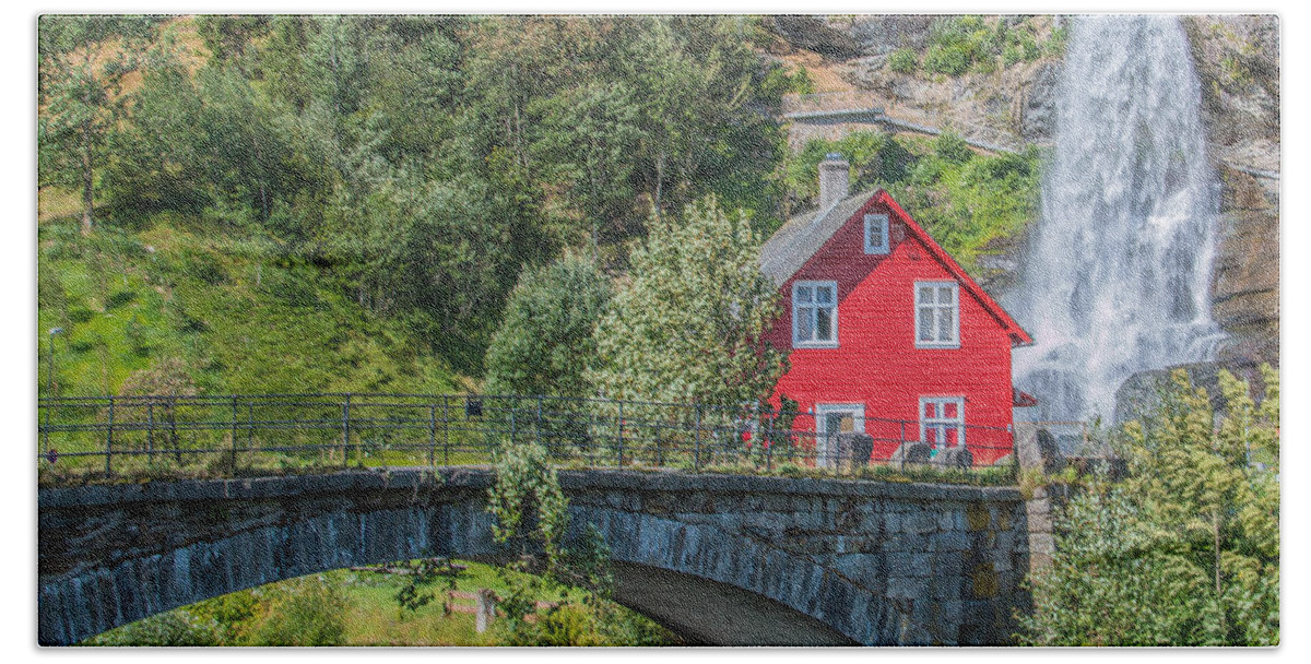 Summer Bath Towel featuring the photograph Red wooden House in front of a Waterfall in Norway by Amanda Mohler