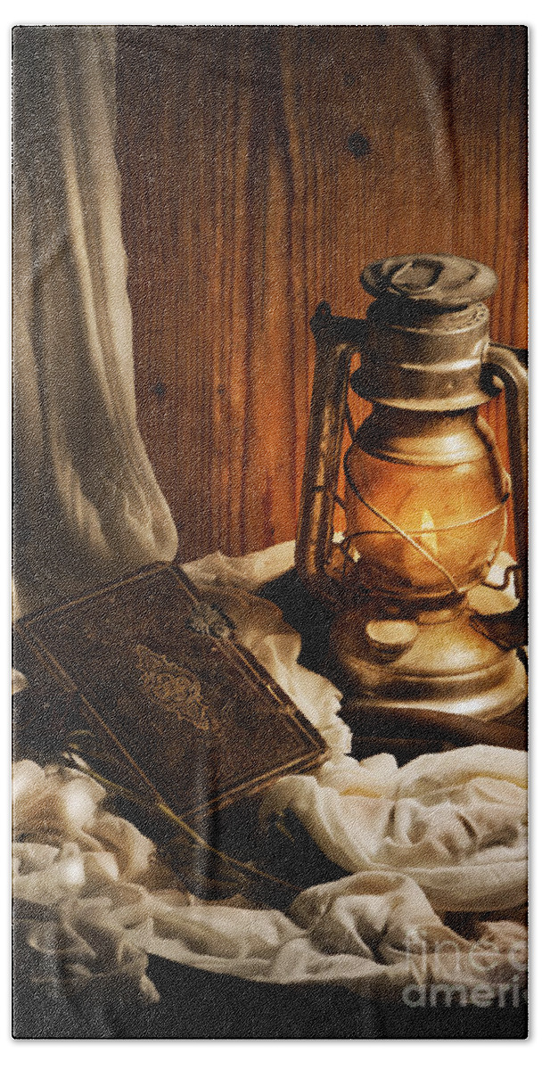 Still Bath Towel featuring the photograph Still Life with Lantern and Old Book by Jelena Jovanovic
