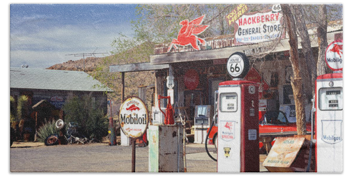 Photography Hand Towel featuring the photograph Store With A Gas Station by Panoramic Images