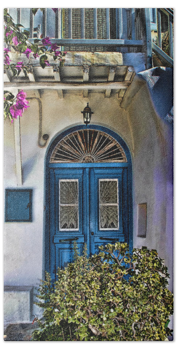 Tom Prendergast Bath Towel featuring the photograph The Blue Door-Santorini by Tom Prendergast