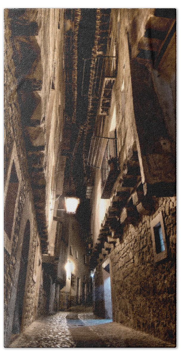 Narrow Street Bath Towel featuring the photograph Narrow street in Albarracin by Weston Westmoreland