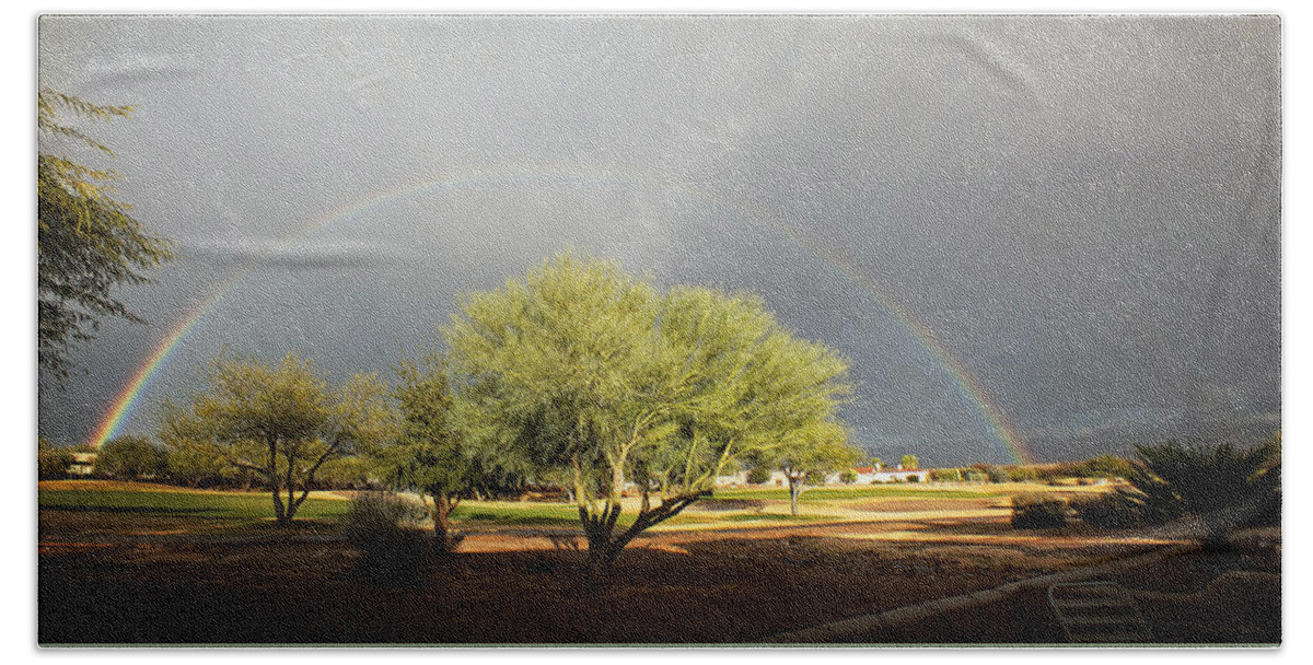 Rainbow Hand Towel featuring the photograph The Rain and The Rainbow by Lucinda Walter