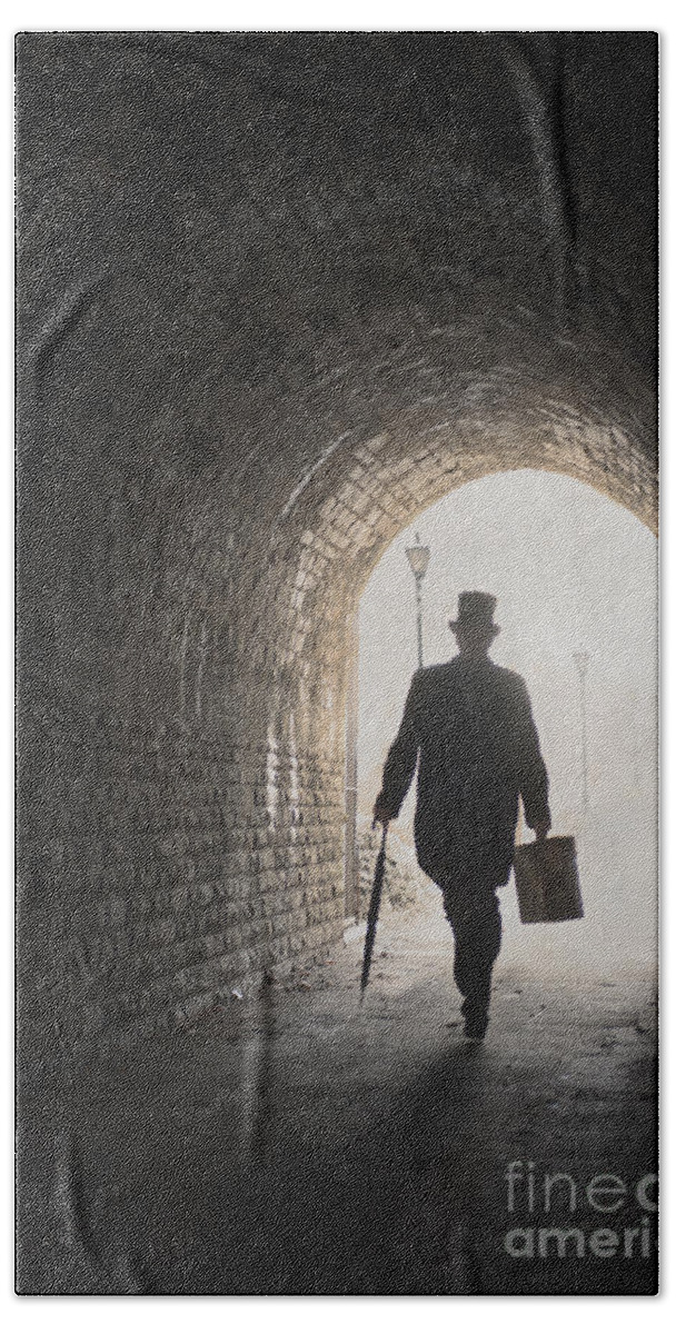 Man Bath Towel featuring the photograph Victorian Man With Top Hat And Case Walking Under A Bridge by Lee Avison