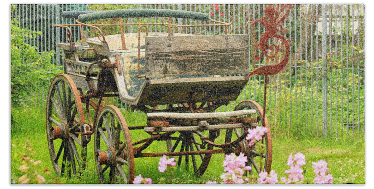 Aged Bath Towel featuring the photograph Vintage horse carriage in a flower bed by Amanda Mohler