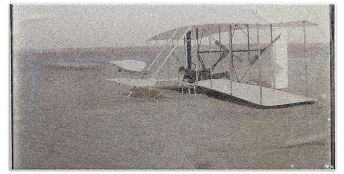 The Wright Brothers Bath Towel featuring the photograph The Wright Brothers Wilbur in prone position in damaged machine by Vintage Collectables