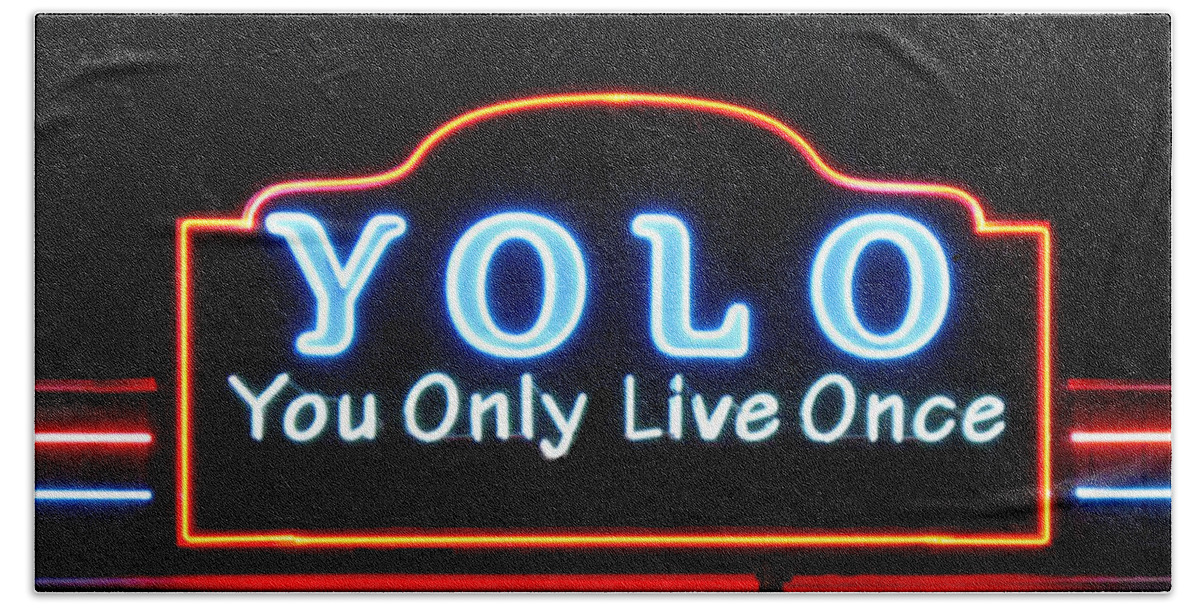 Yolo Bath Towel featuring the photograph YOLO You Only Live Once neon light design by Tom Conway