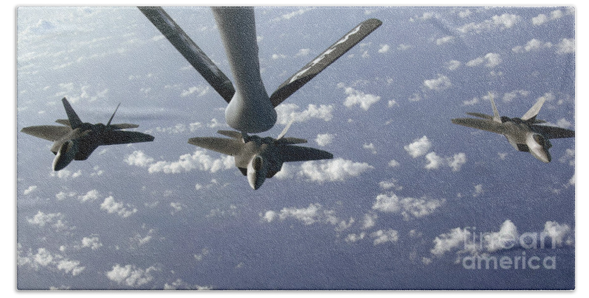 F-22 Raptor Hand Towel featuring the photograph A Three Ship Formation Of F-22 Raptors #2 by Stocktrek Images