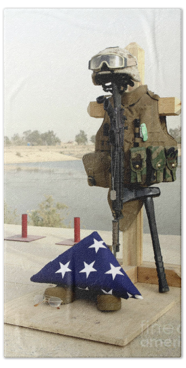 Armor Hand Towel featuring the photograph A Fallen Soldiers Gear Display by Stocktrek Images