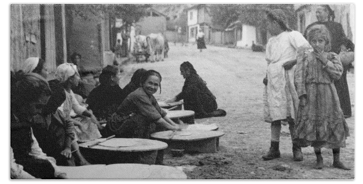 Berkovitsa Bath Towel featuring the photograph Berkovitsa Bulgaria - Women making bread in the streets - c 1911 by International Images