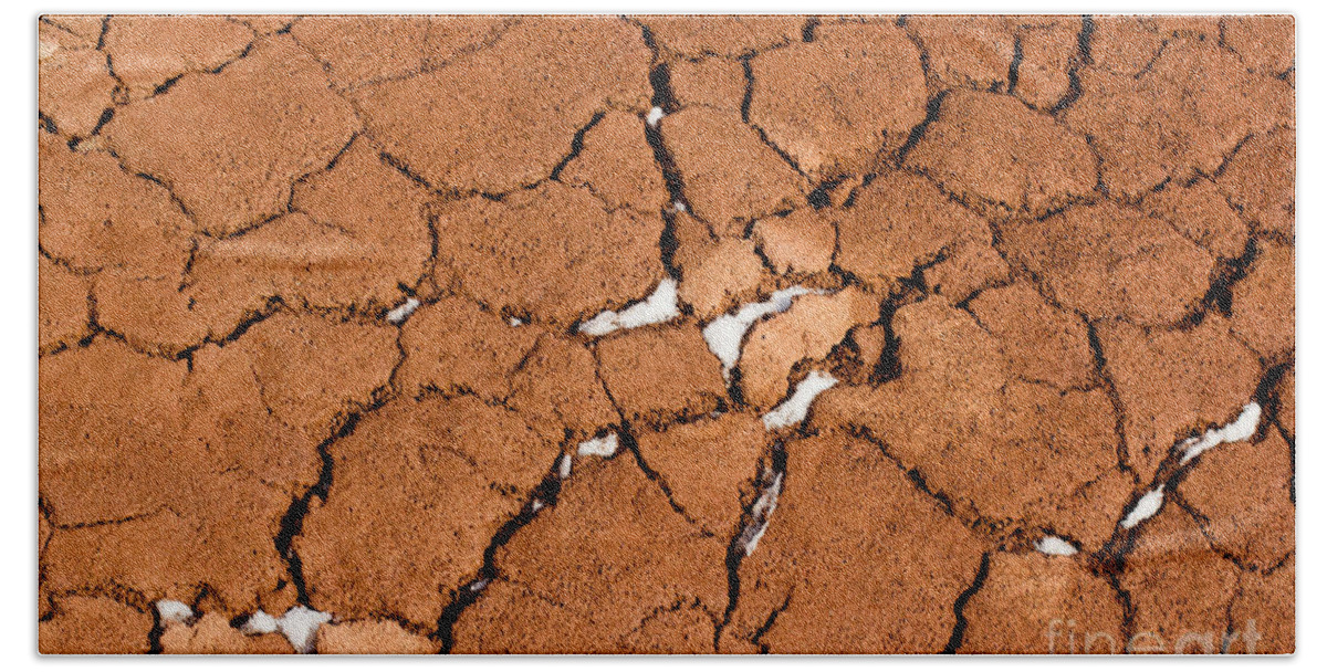 Agriculture Hand Towel featuring the photograph Cracked red soil by Les Palenik