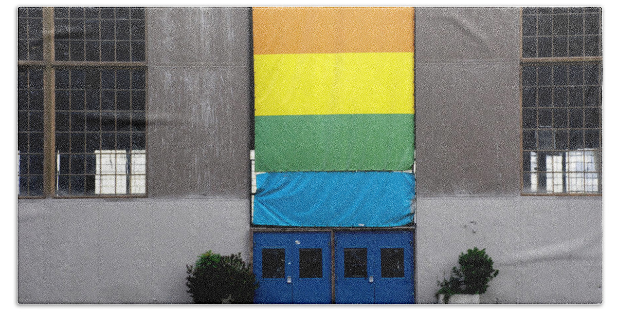 Industrial Hand Towel featuring the photograph Rainbow Banner Building by Kathleen Grace