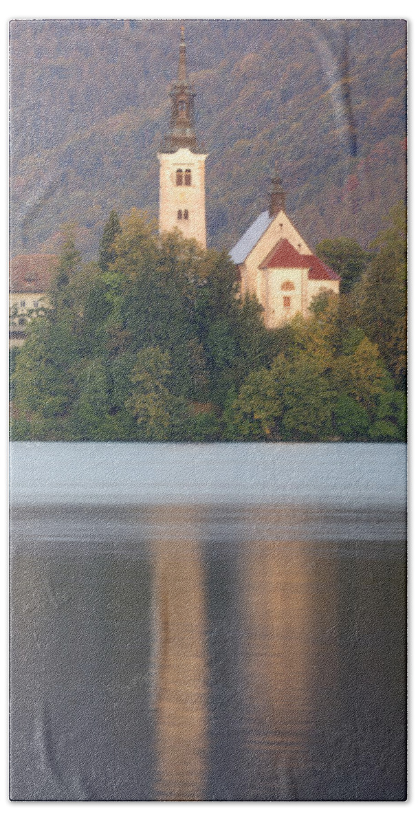 Bled Bath Towel featuring the photograph Sunrise over Lake Bled and the island church by Ian Middleton