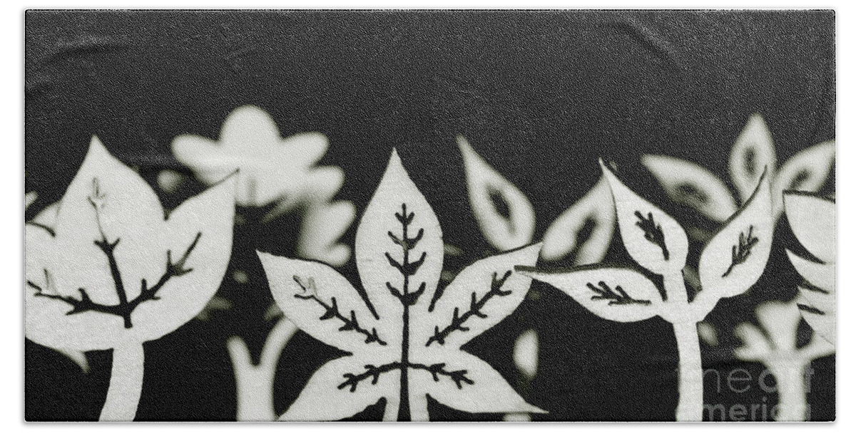 Leaf Bath Towel featuring the photograph Wooden leaf shapes in black and white by Simon Bratt