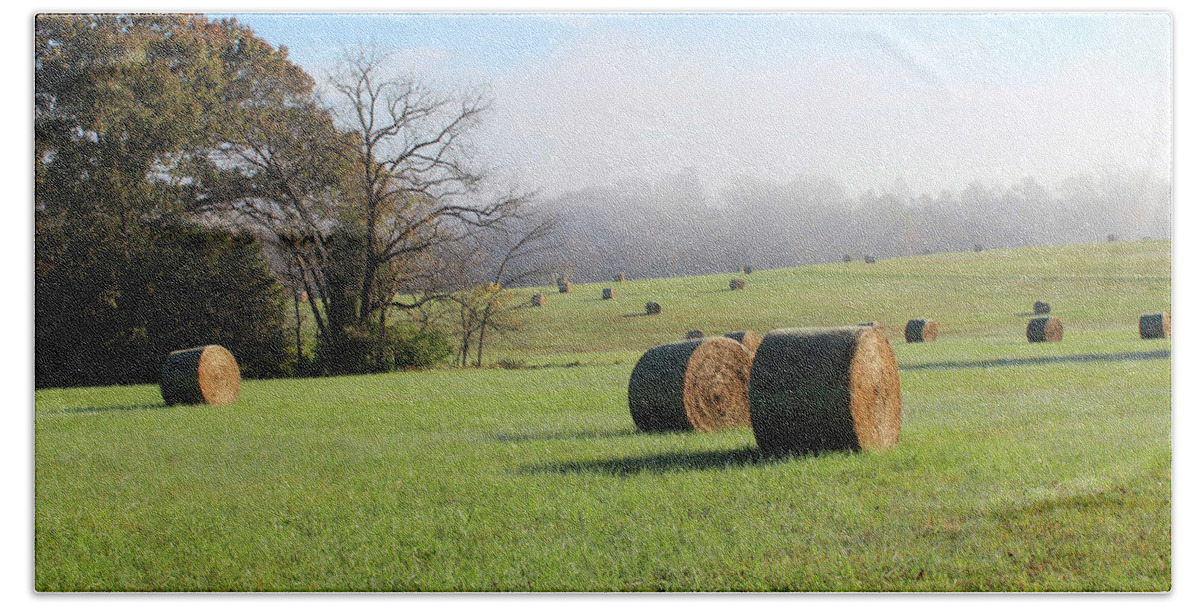 Bale Hand Towel featuring the photograph Hay Bales in a Missouri field on a sunny and foggy morning #2 by Adam Long