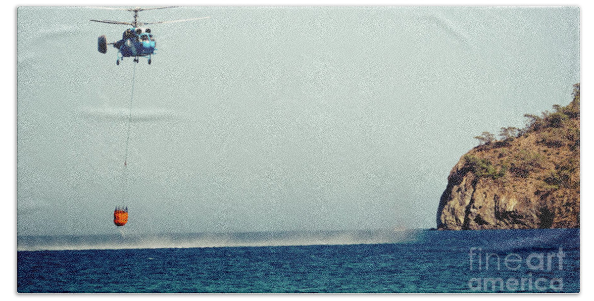 Aerospace Bath Towel featuring the photograph Helicopter firefighter take water in the sea #1 by Raimond Klavins