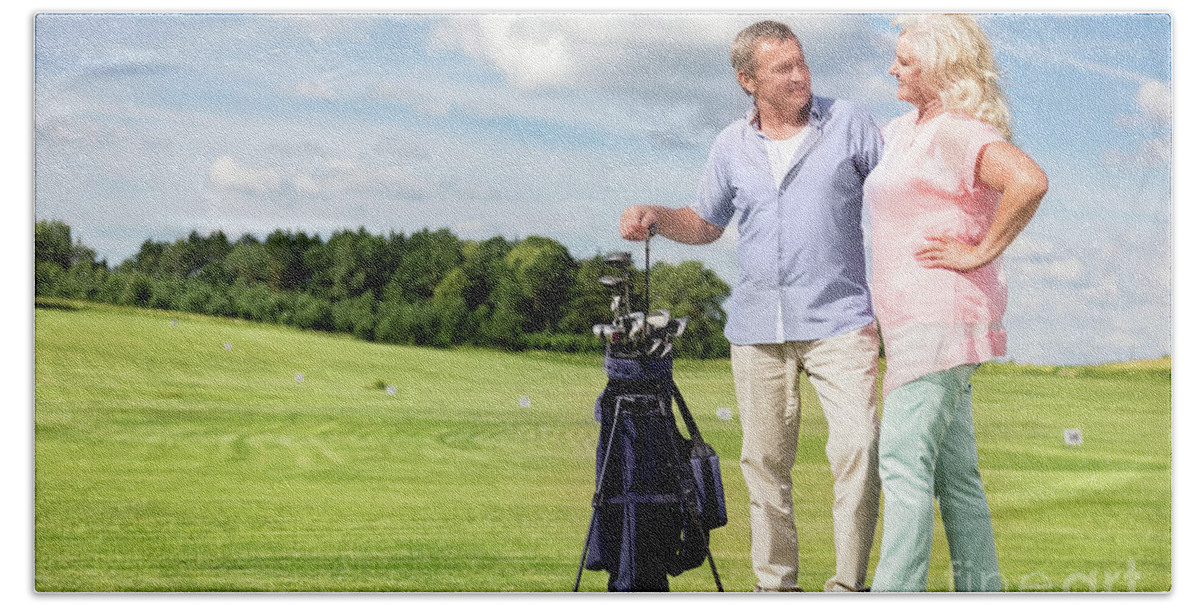 Golf Bath Towel featuring the photograph Senior couple enjoying golf game. #1 by Michal Bednarek