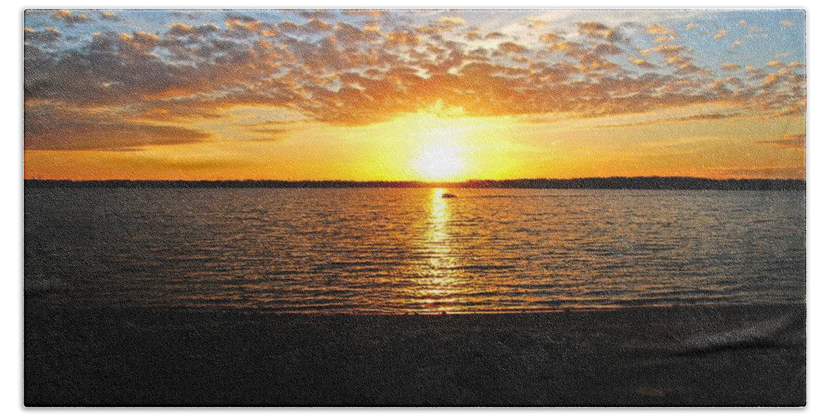 Sunset Bath Towel featuring the photograph A Boat in the Evening by Mike Murdock
