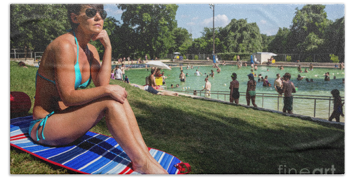 Deep Eddy Pool Hand Towel featuring the photograph A fit Austin woman sunbathes in a bikini at Deep Eddy Pool, surrounded by grassy slopes which are the best in Austin for sunbathing by Dan Herron