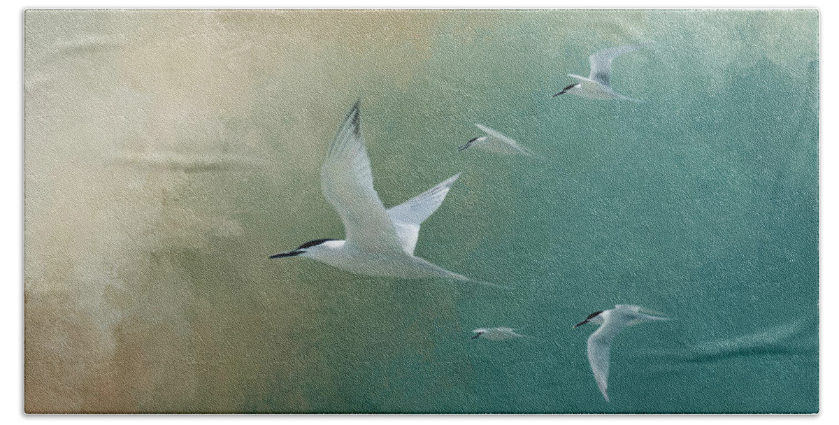 Egmont Key Hand Towel featuring the photograph A Flight Of Terns by Marvin Spates