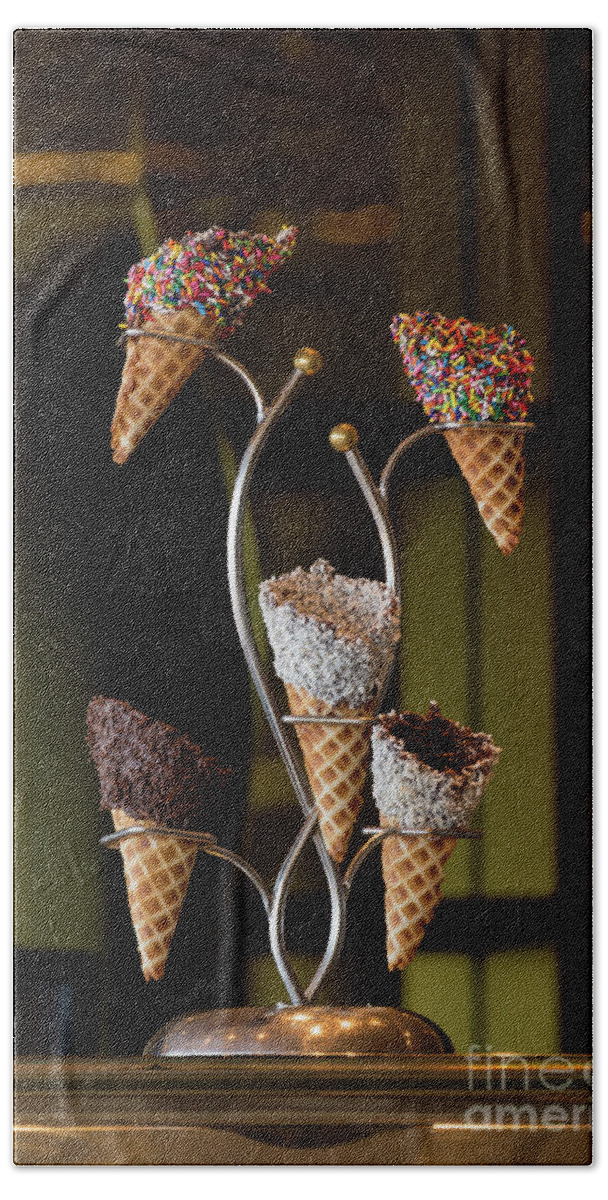 Dessert Bath Towel featuring the photograph A rack of five fancy waffle ice creame cones by Daniel Ryan