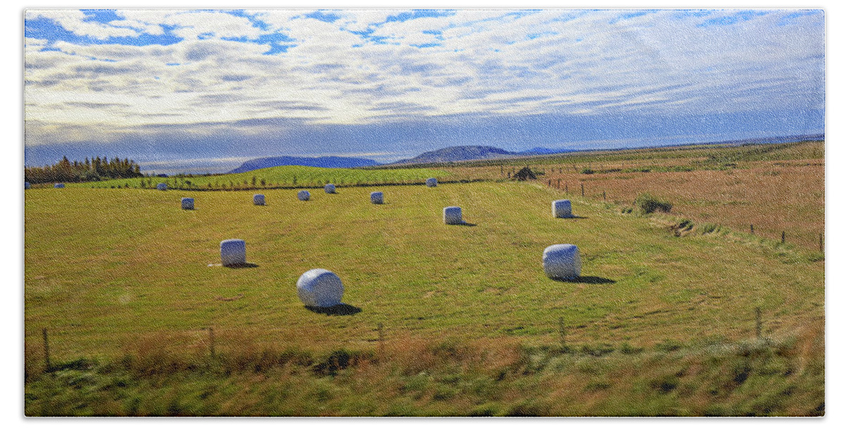  Iceland Bath Towel featuring the photograph Bales of hay for the animals near Reykjavik, Iceland by Allan Levin