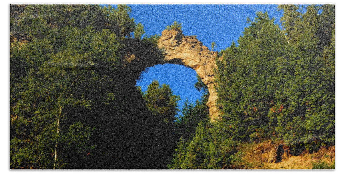 Mackinac Island Hand Towel featuring the photograph Beneath Arch Rock by Keith Stokes