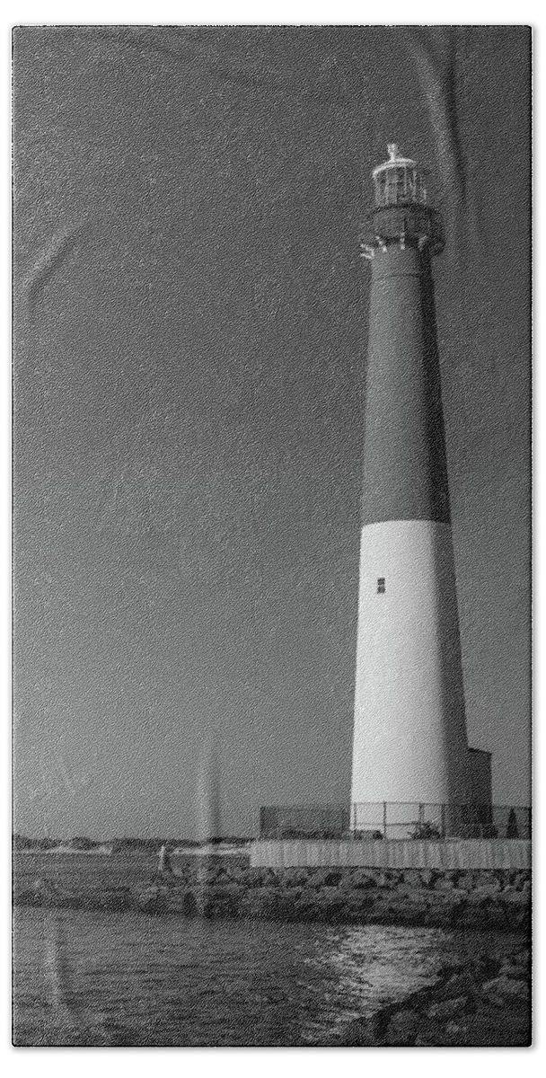 Barnegat Lighthouse And Inlet New Jersey Black And White Hand Towel featuring the photograph Barnegat Lighthouse and Inlet New Jersey Black and White by Terry DeLuco