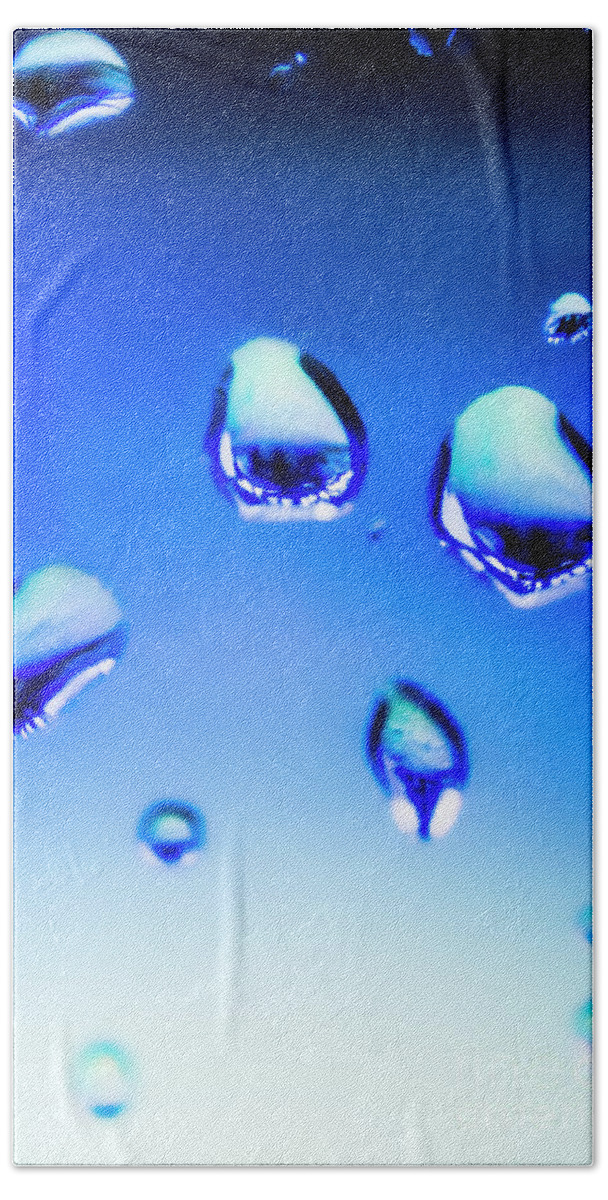 Water Bath Towel featuring the photograph Blue water droplets on glass by Jorgo Photography