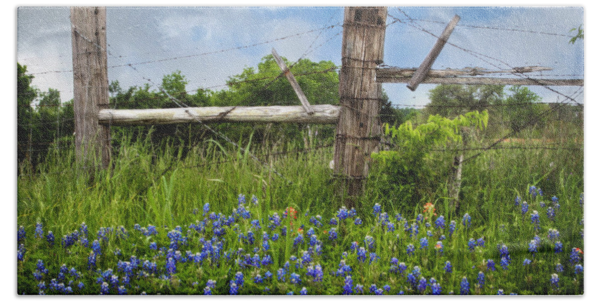 Bloom Bath Towel featuring the photograph Bluebonnets and Fence by David and Carol Kelly
