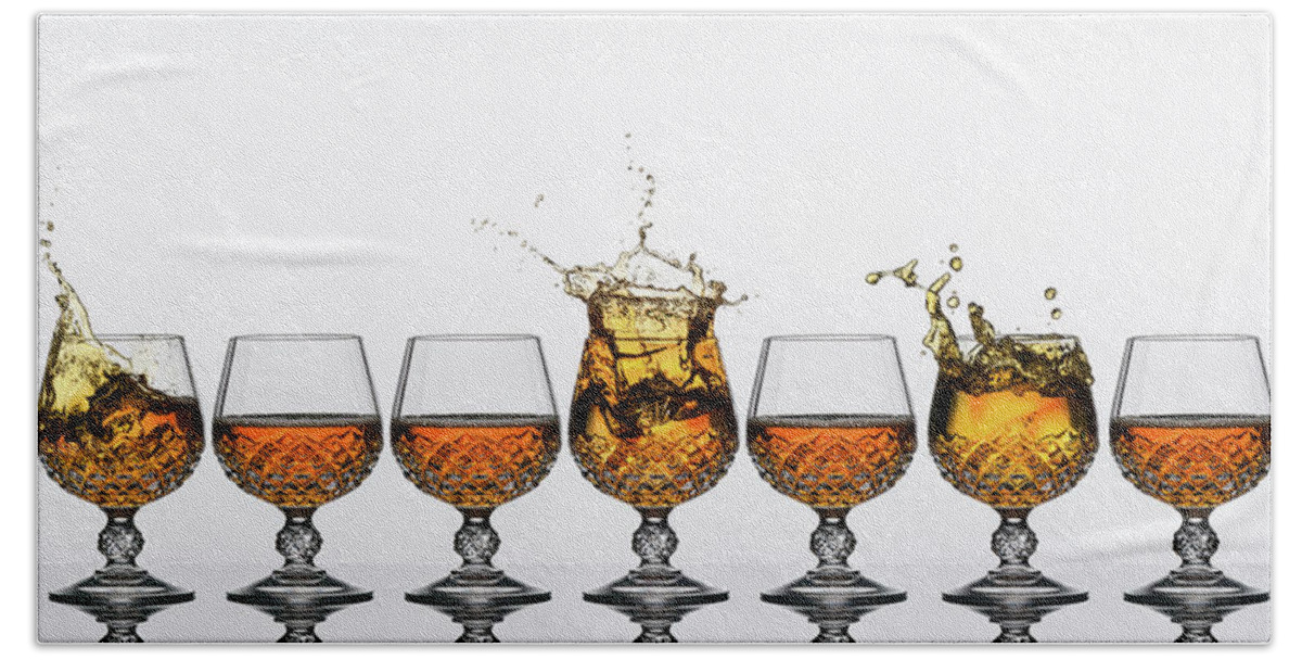 Alcohol Hand Towel featuring the photograph Brandy Glass Splash by Andy Astbury