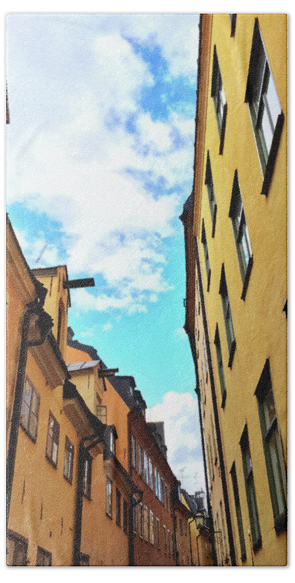 Stockholm Bath Towel featuring the photograph Bright buildings in the old center of Stockholm by GoodMood Art