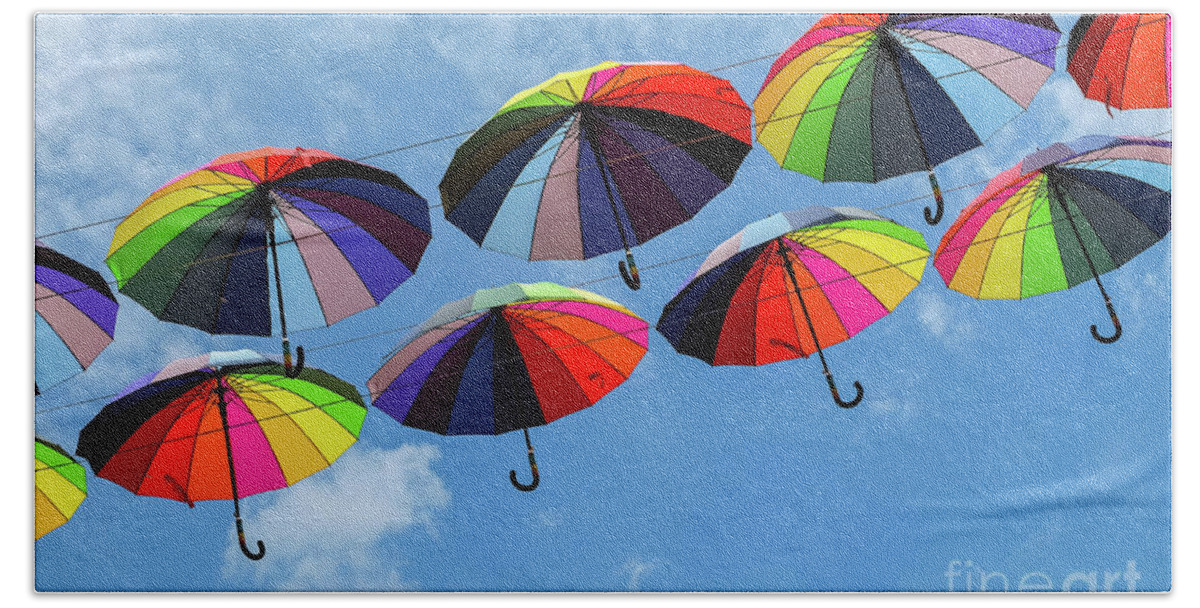 Umbrella Hand Towel featuring the photograph Bright colorful umbrellas by Iryna Liveoak