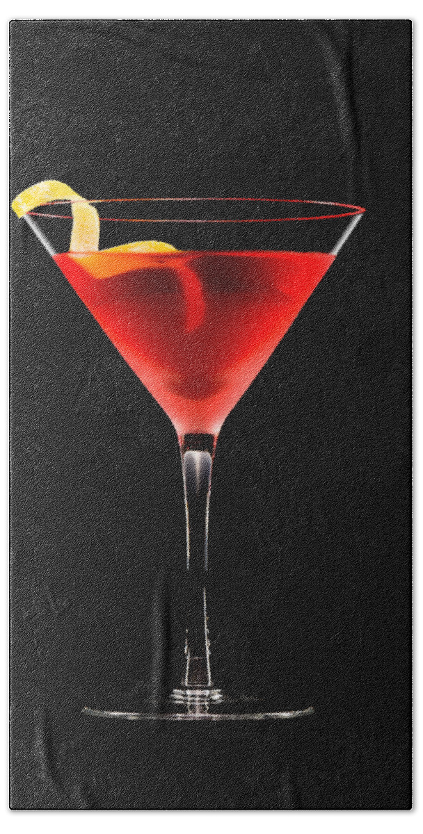 Alcohol Hand Towel featuring the photograph Cosmopolitan cocktail in front of a black background by U Schade