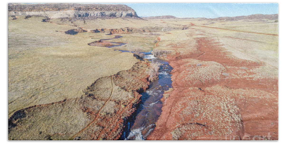 Colorado Hand Towel featuring the photograph creek at Colorado foothills - aerial view by Marek Uliasz