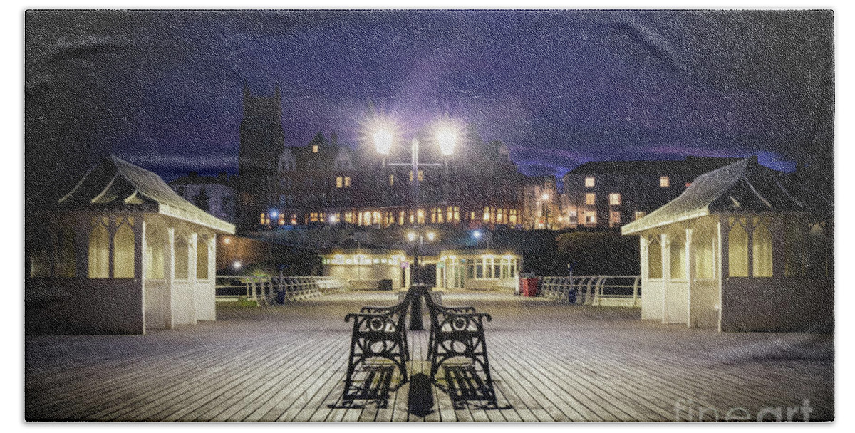 Pier Hand Towel featuring the photograph Cromer pier at night in Norfolk England by Simon Bratt