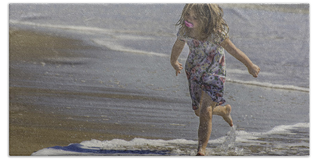 Dancing Bath Towel featuring the photograph Dancing in the surf with a pink pacifier by WAZgriffin Digital