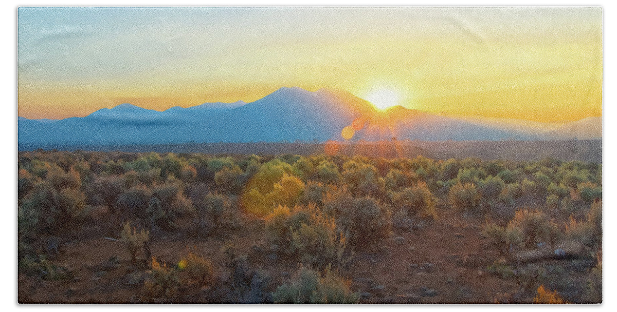  Dawn Bath Towel featuring the photograph Dawn over magic Taos mountain by Charles Muhle