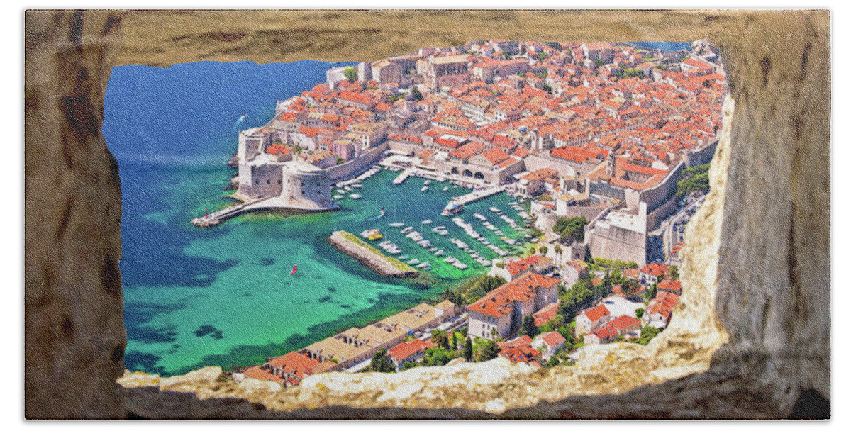 Dubrovnik Bath Towel featuring the photograph Dubrovnik historic city and harbor aerial view through stone win by Brch Photography