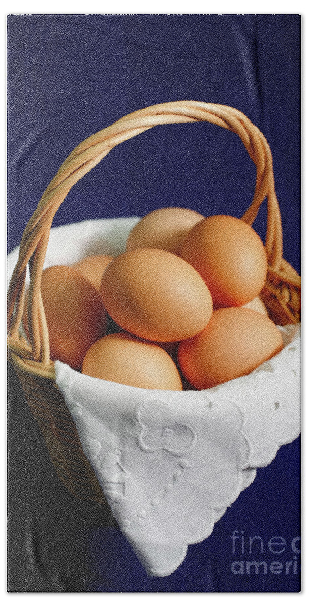 Eggs Hand Towel featuring the photograph Eggs in a wicker basket. by Gaspar Avila