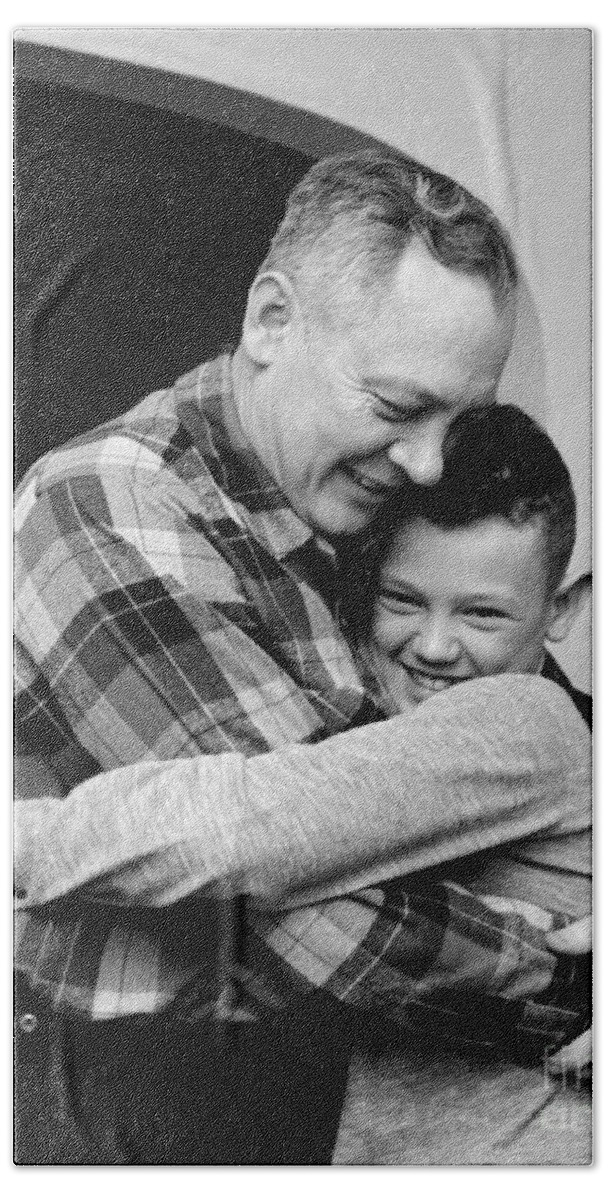 1950s Bath Towel featuring the photograph Father And Son Embracing, C.1950-60s by H. Armstrong Roberts/ClassicStock