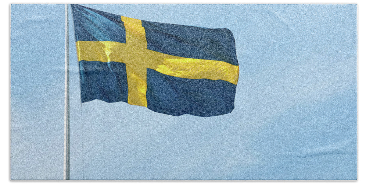 Sweden Bath Towel featuring the photograph Flag of Sweden in the blue sky by GoodMood Art