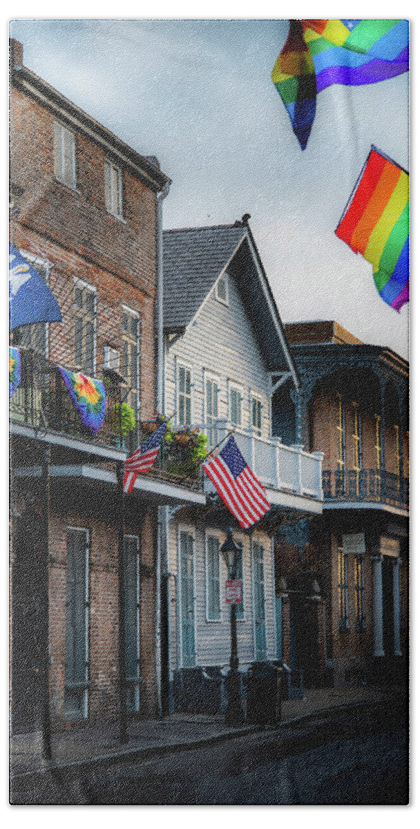 Fine Art New Orleans Bath Towel featuring the photograph Flags On Bourbon by Greg and Chrystal Mimbs