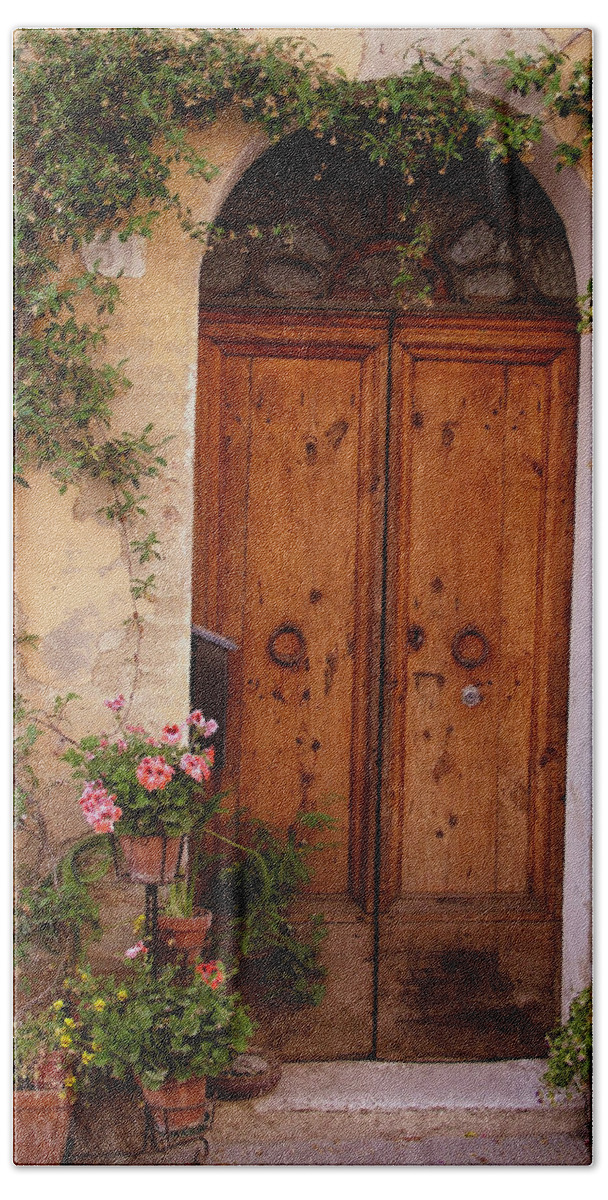 Tuscany Bath Towel featuring the photograph Flowered Tuscan Door by Donna Corless