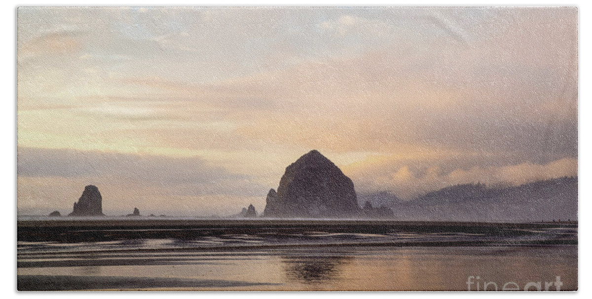 Haystack Rock Hand Towel featuring the photograph Haystack rock after the rain by Paul Quinn