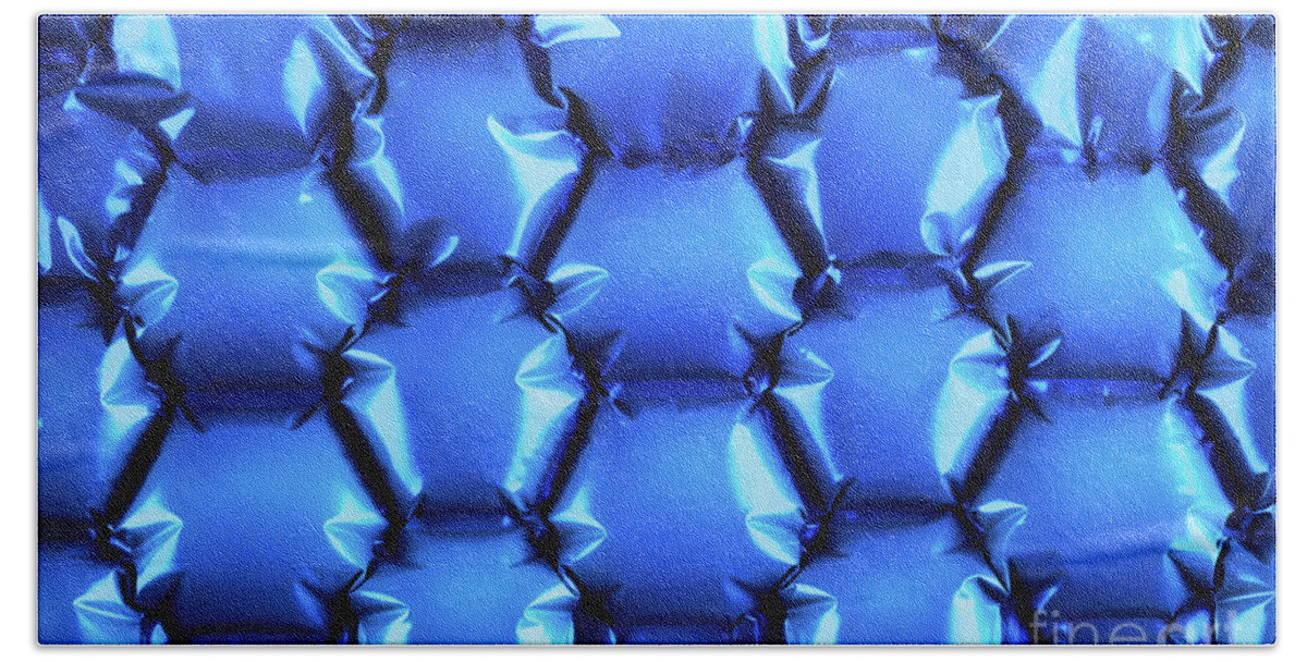 Abstract Hand Towel featuring the photograph Hexagonal blue bubble textured background by Simon Bratt